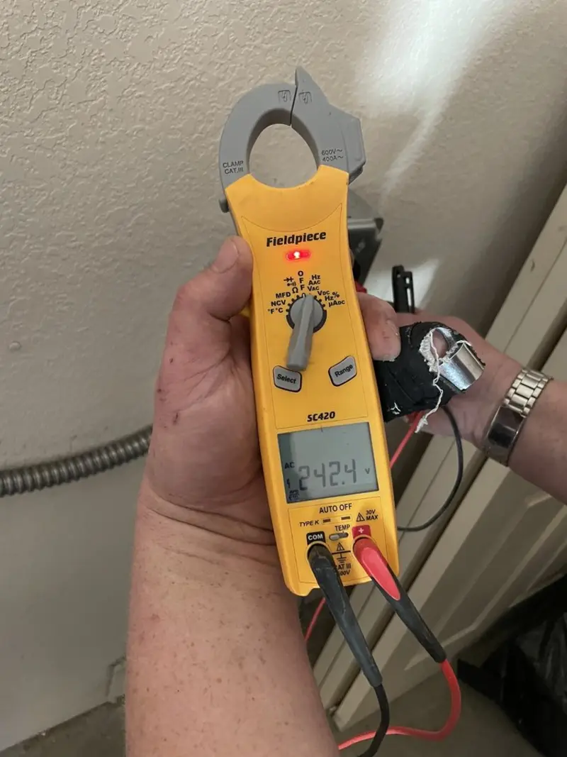 Voltage testing with clamp meter during Electrical Installation Services in Evesham